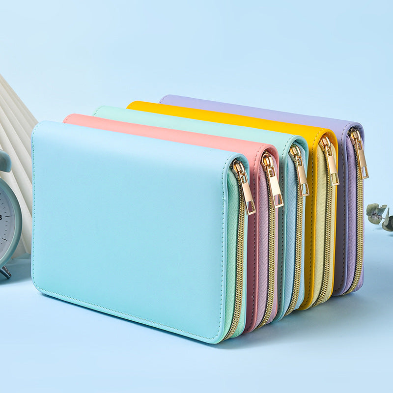 Pastel A5 zip-around notebook organisers standing together with a light blue cover at the front