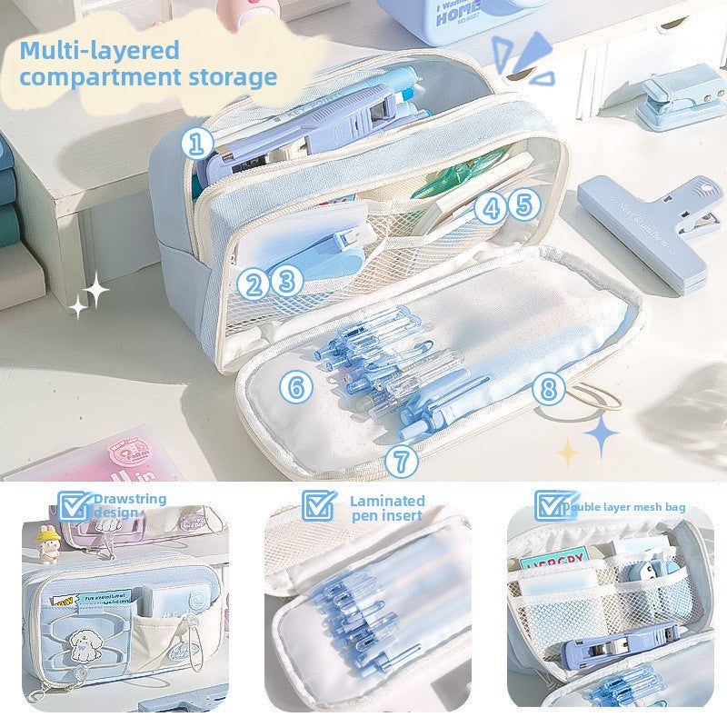 Open Sea Salt Blue pencil case showing several zip compartments and stationery storage sections
