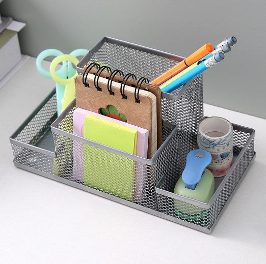 Silver metal mesh desk organiser with scissors, pencils and sticky notes