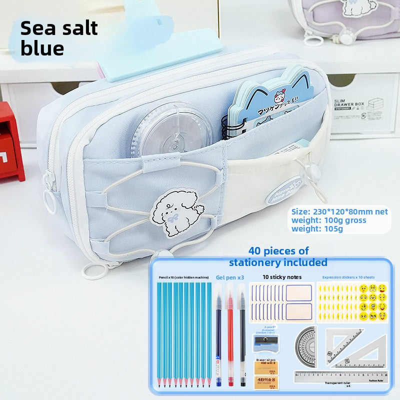 Sea Salt Blue multi-compartment pencil case open with stationery and illustration of accessory set