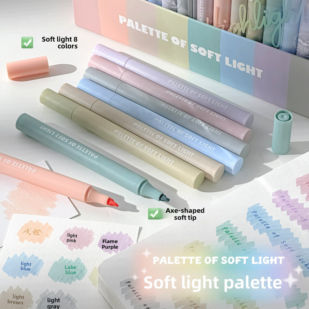 Pastel highlighter pens laid out beside colour swatches on paper
