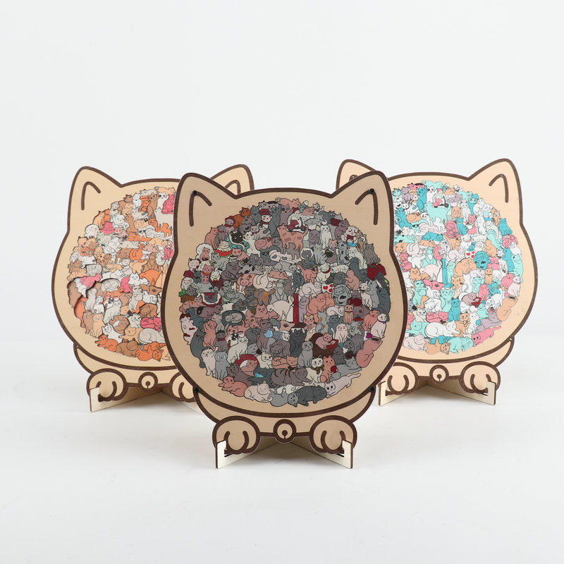 Three cat-shaped wooden jigsaw puzzle designs displayed together with colourful patterned centres